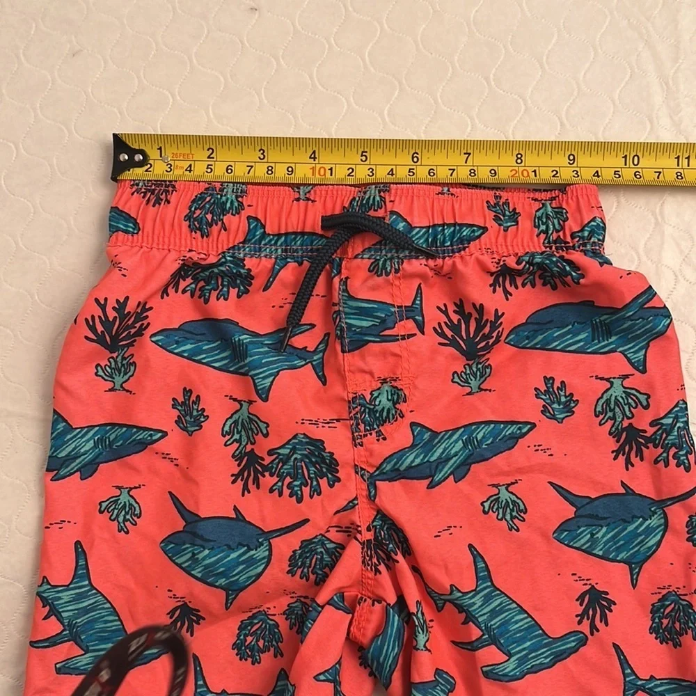Old Navy coral and teal shark print lined swim trunks